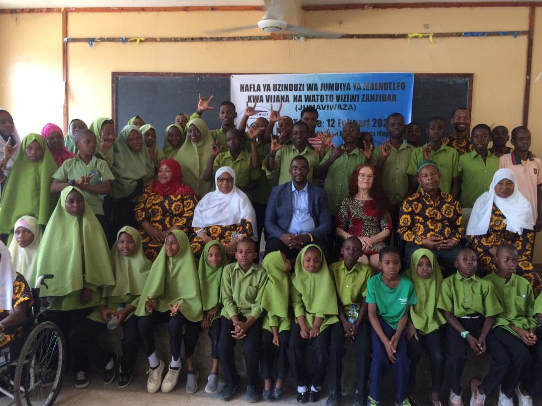 Lorraine with children at Deaf school in Tanzania